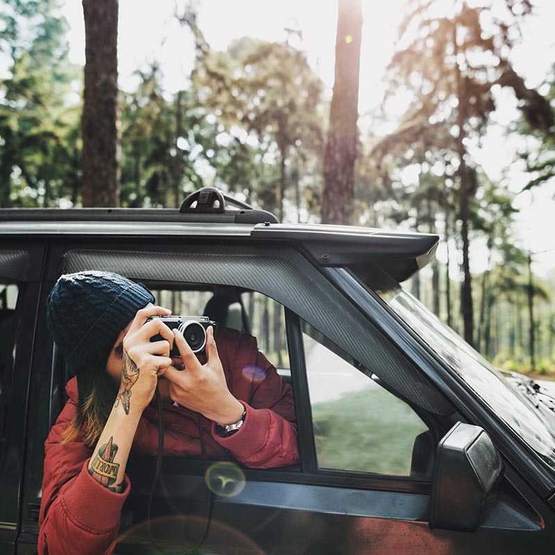 guy-taking-photos-road-trip-concept-PQ36NGL-copy.jpg